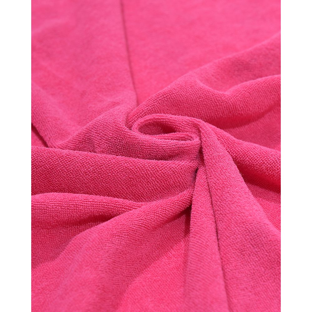 Close-up of bright pink fabric with a textured surface