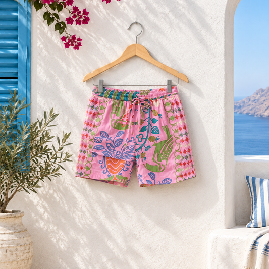 Women’s pink printed shorts with colourful floral pattern, elasticated waist and drawstring, perfect for summer and resort wear.