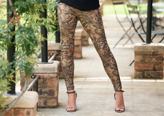 Women's paisley print skinny pants in stretch fabric styled with black poloneck – boho chic fitted trousers for smart casual fashion.